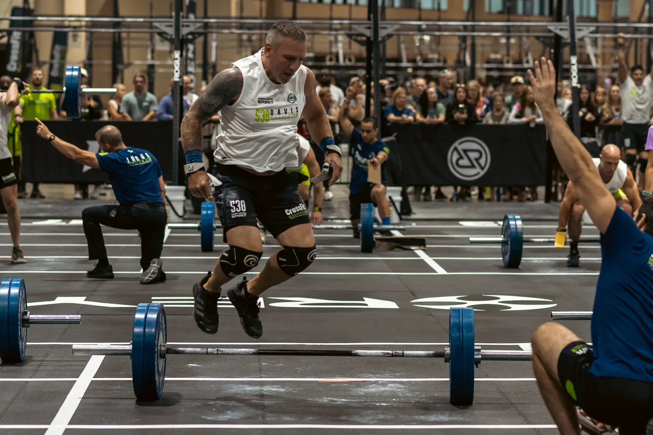 Competitor mid rep on the CrossFit Games floor