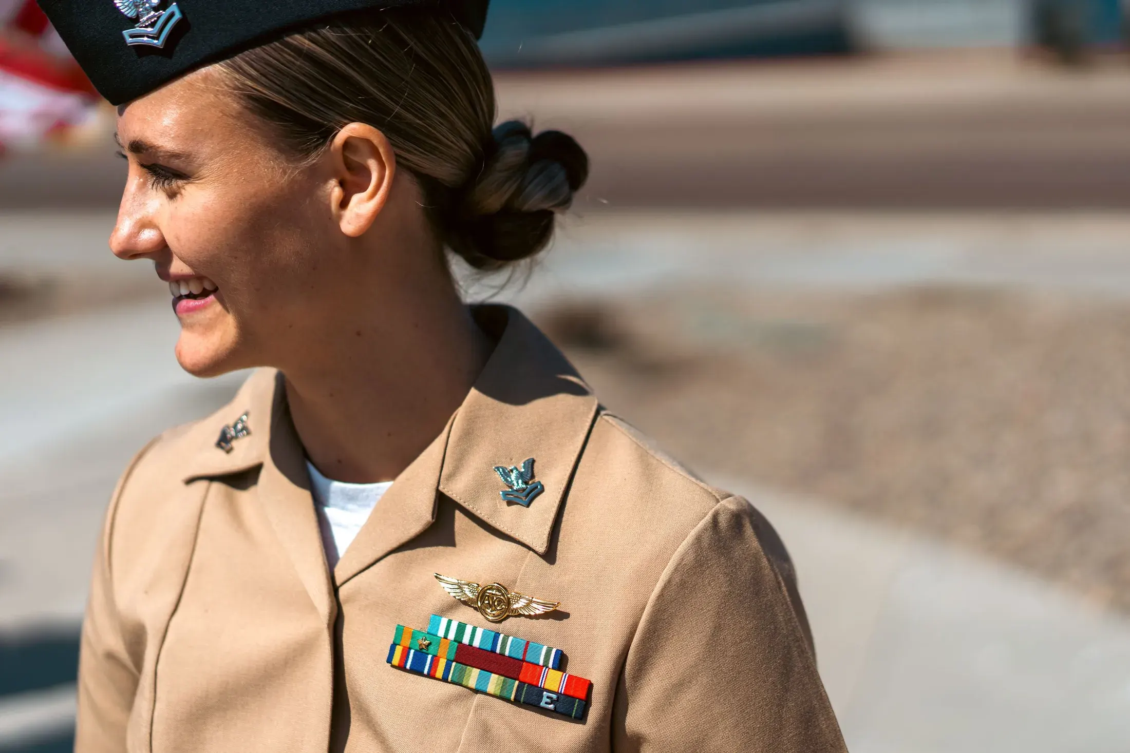 Smiling sailor in khakis with ribbons