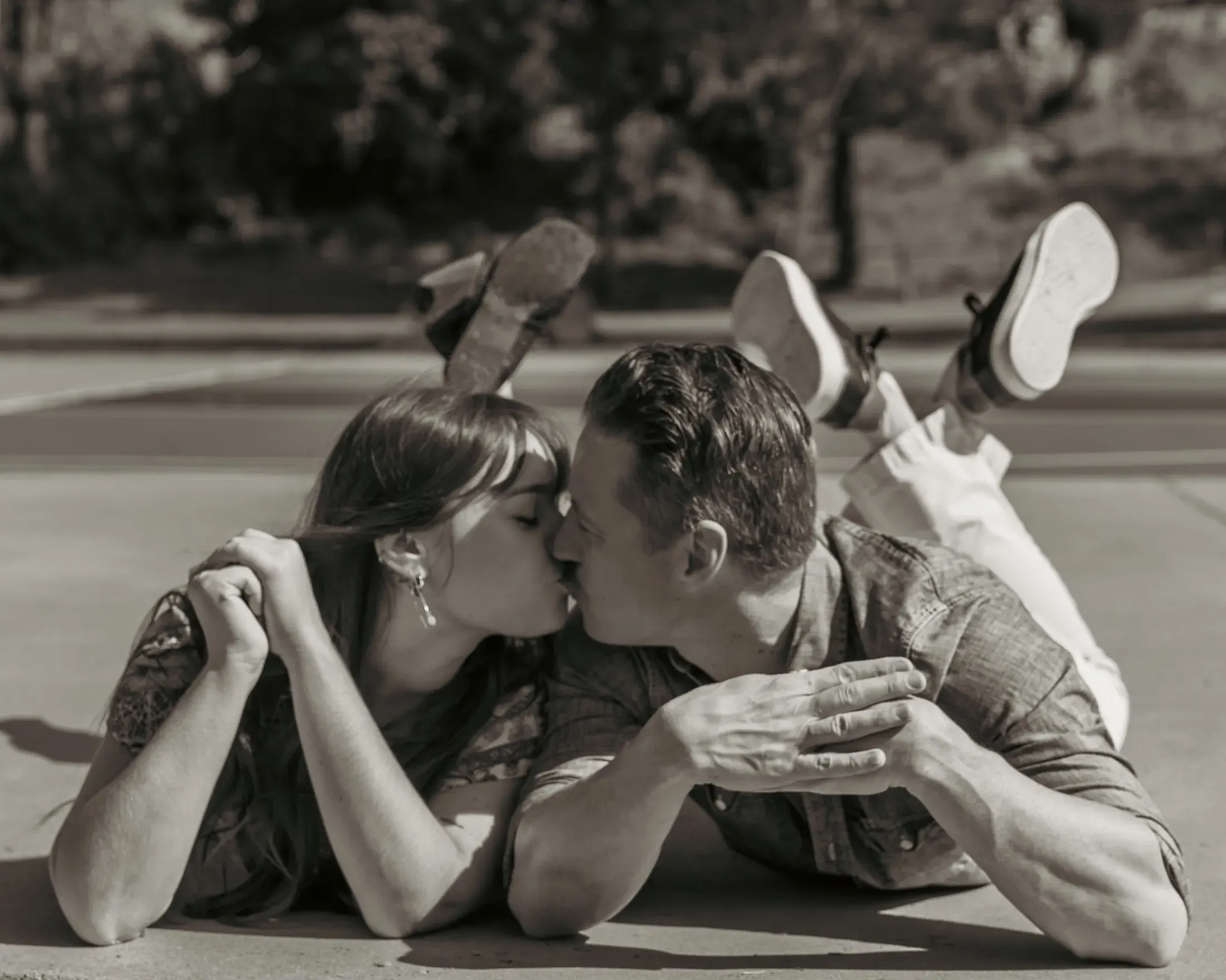 Black and white photo of a couple sharing a kiss