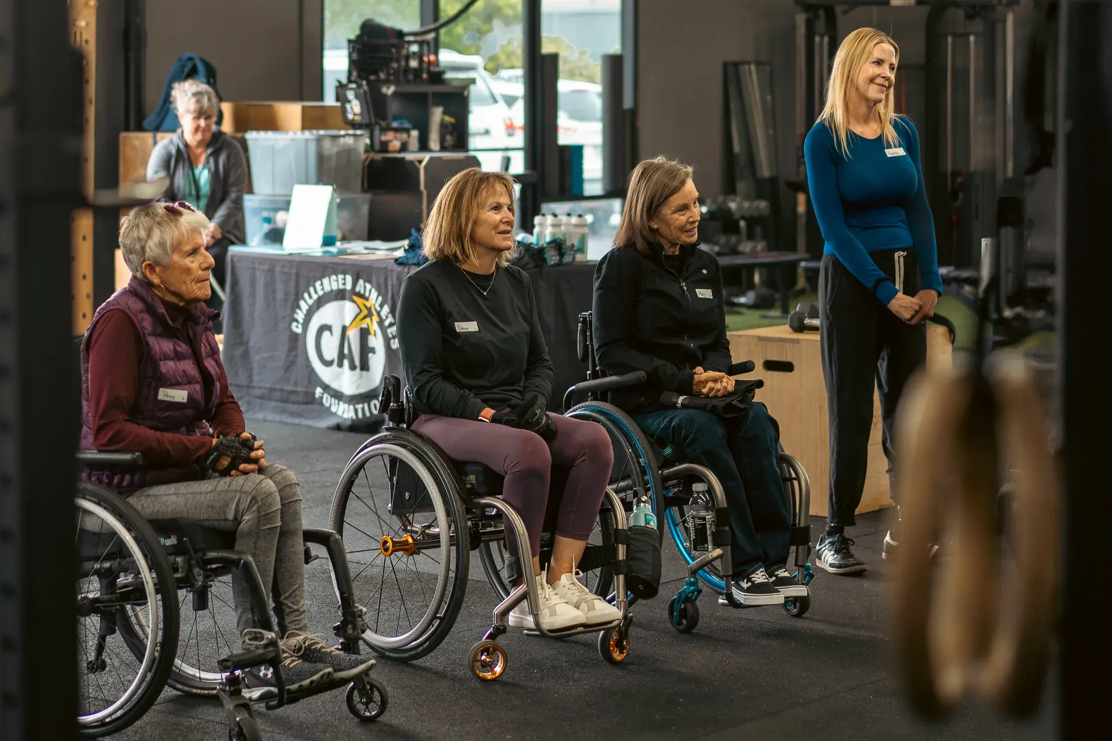 Adaptive athletes and coaches at a gym event