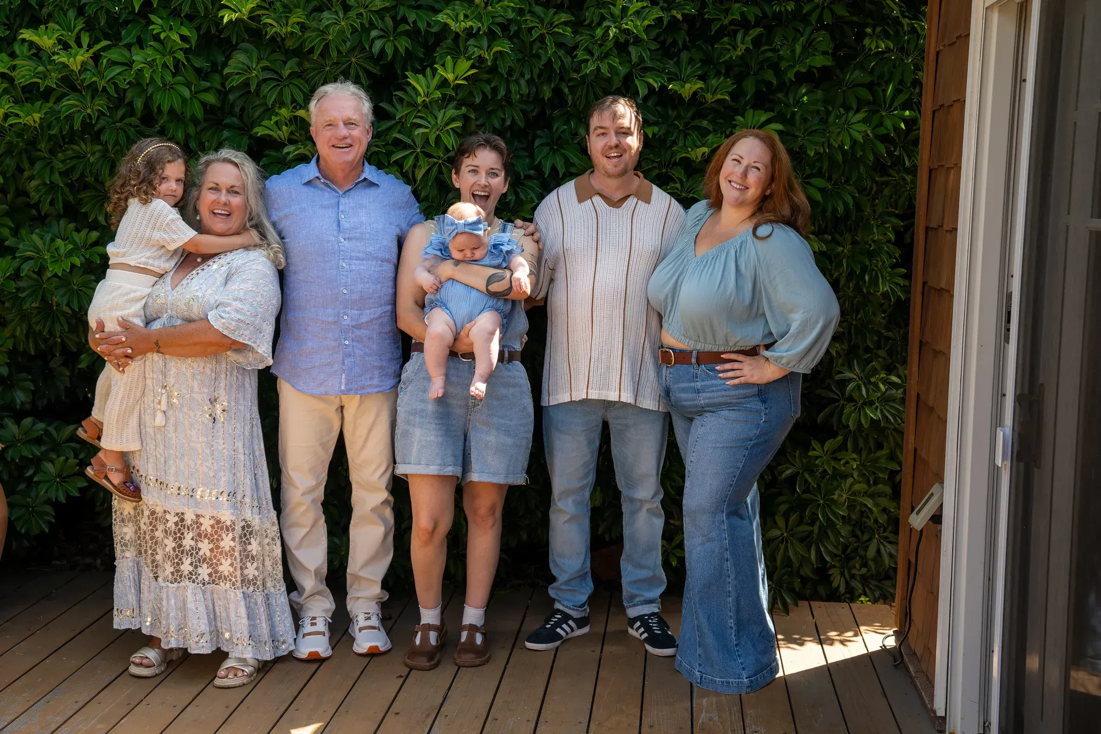 Three generations of a family on the porch