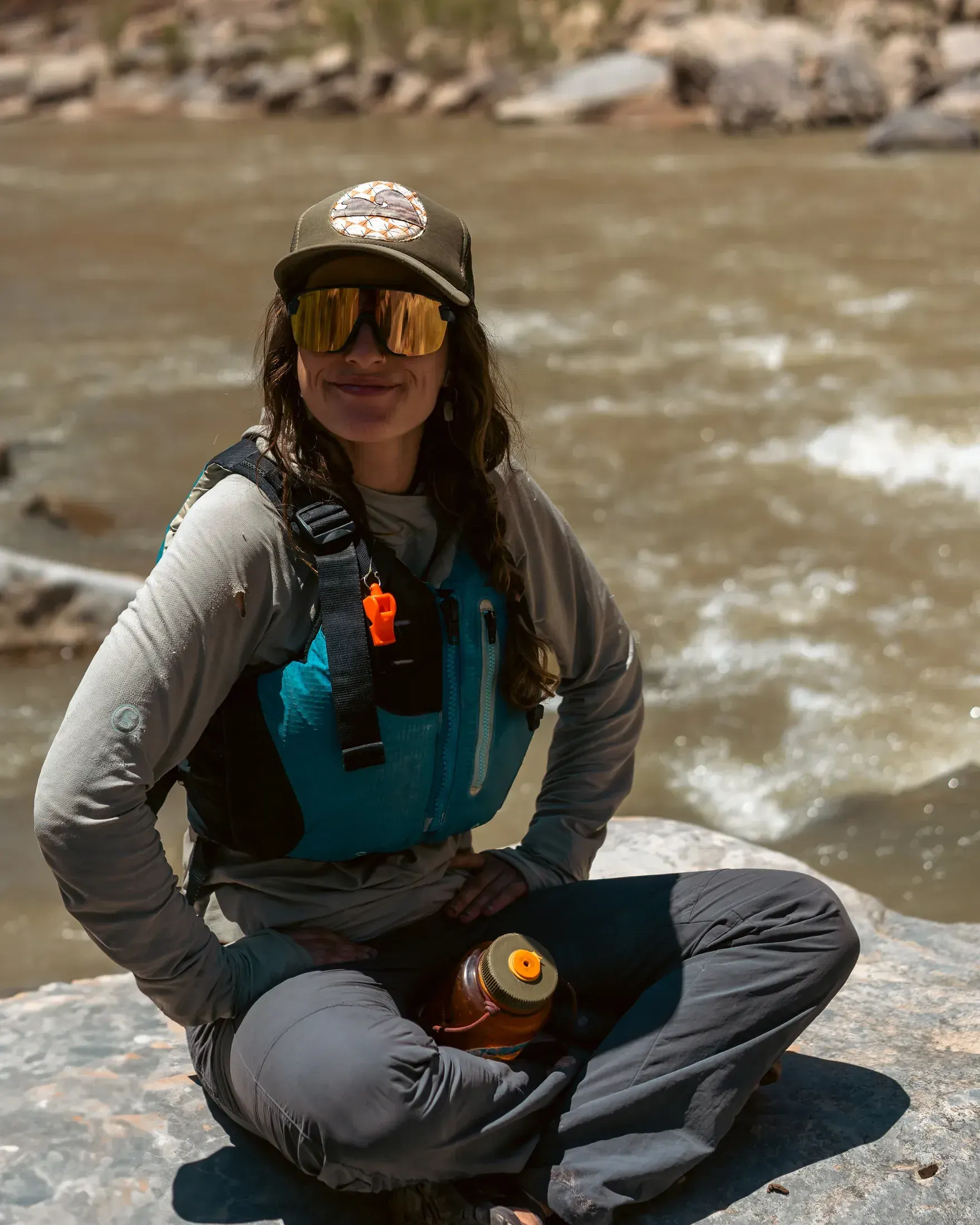 River guide taking a break on the rocks