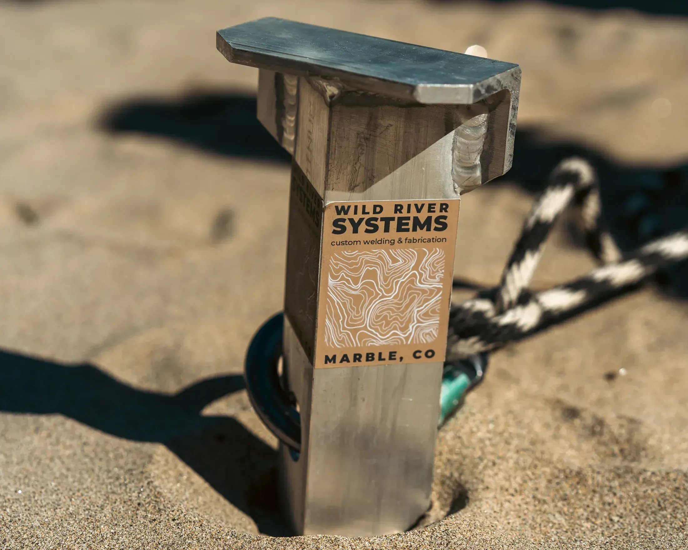 Wild River Systems anchor stake in the sand