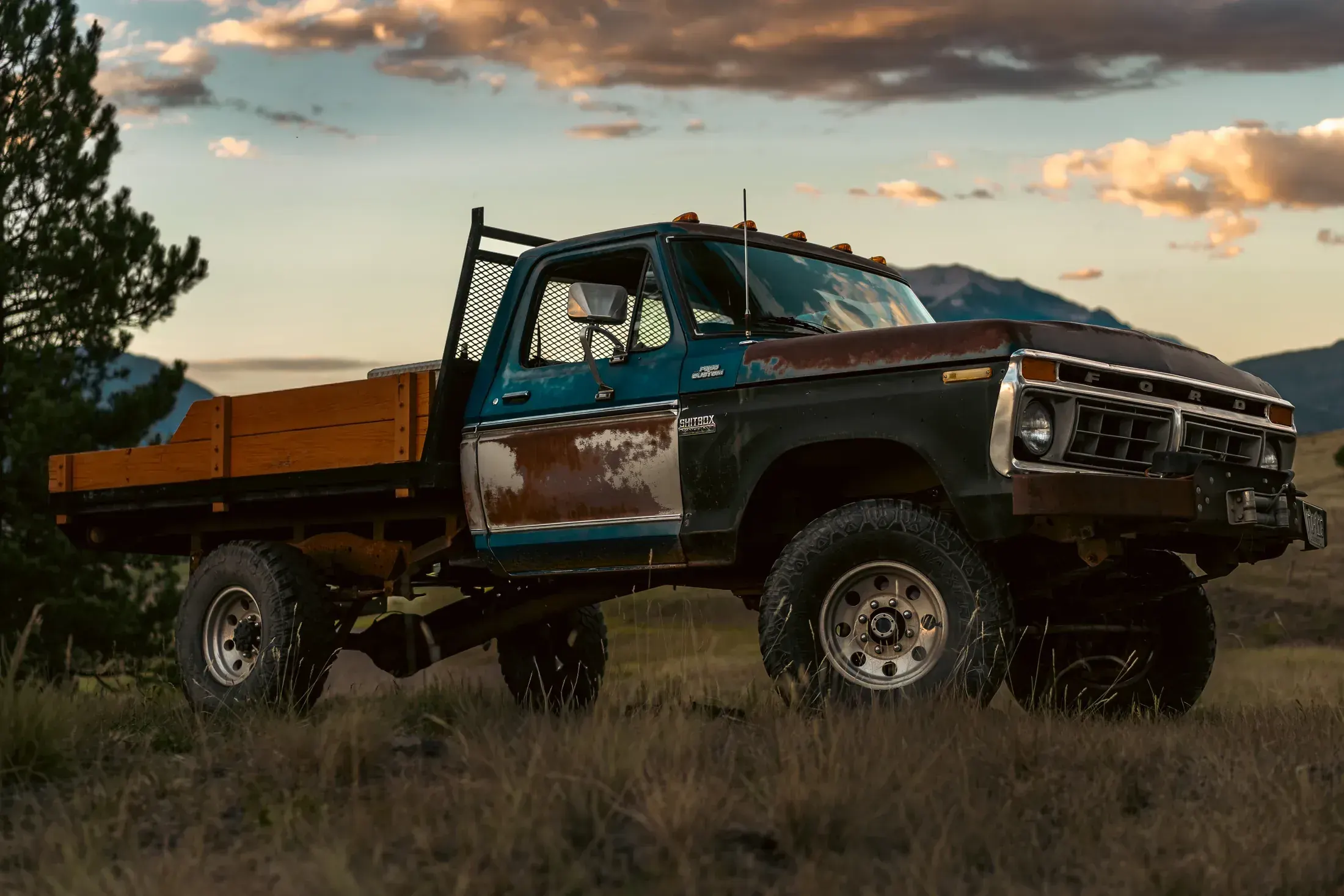 Restored vintage pickup in a mountain meadow