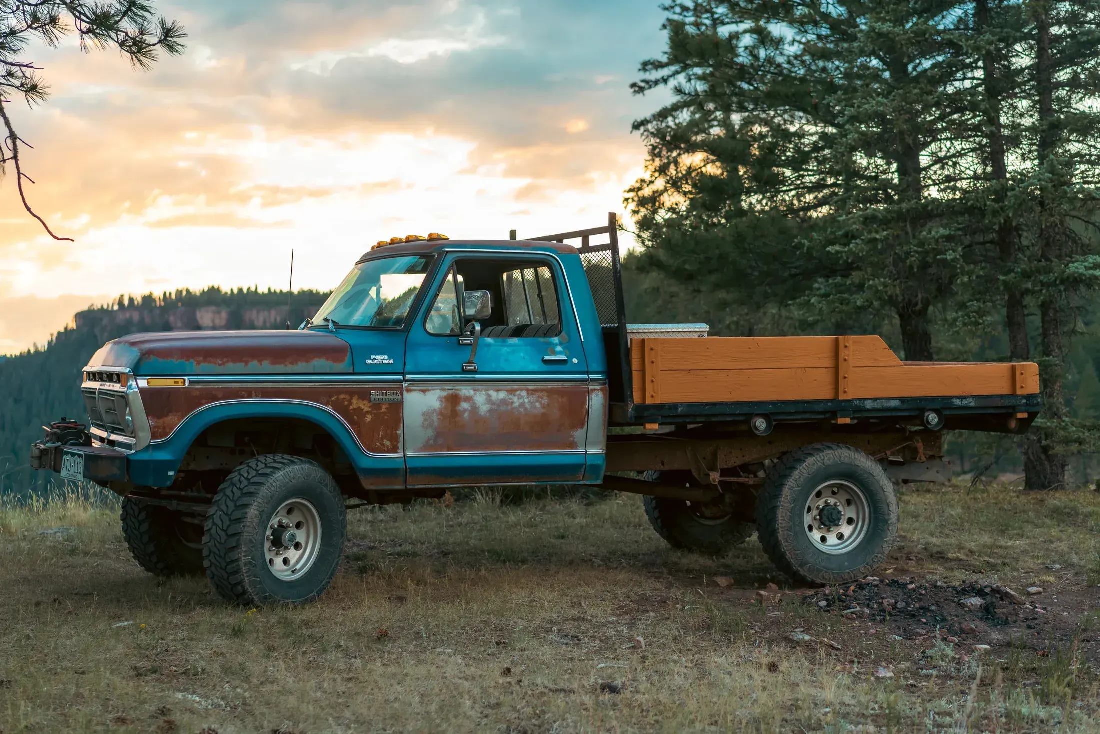 Vintage pickup with a wooden flatbed at golden hour