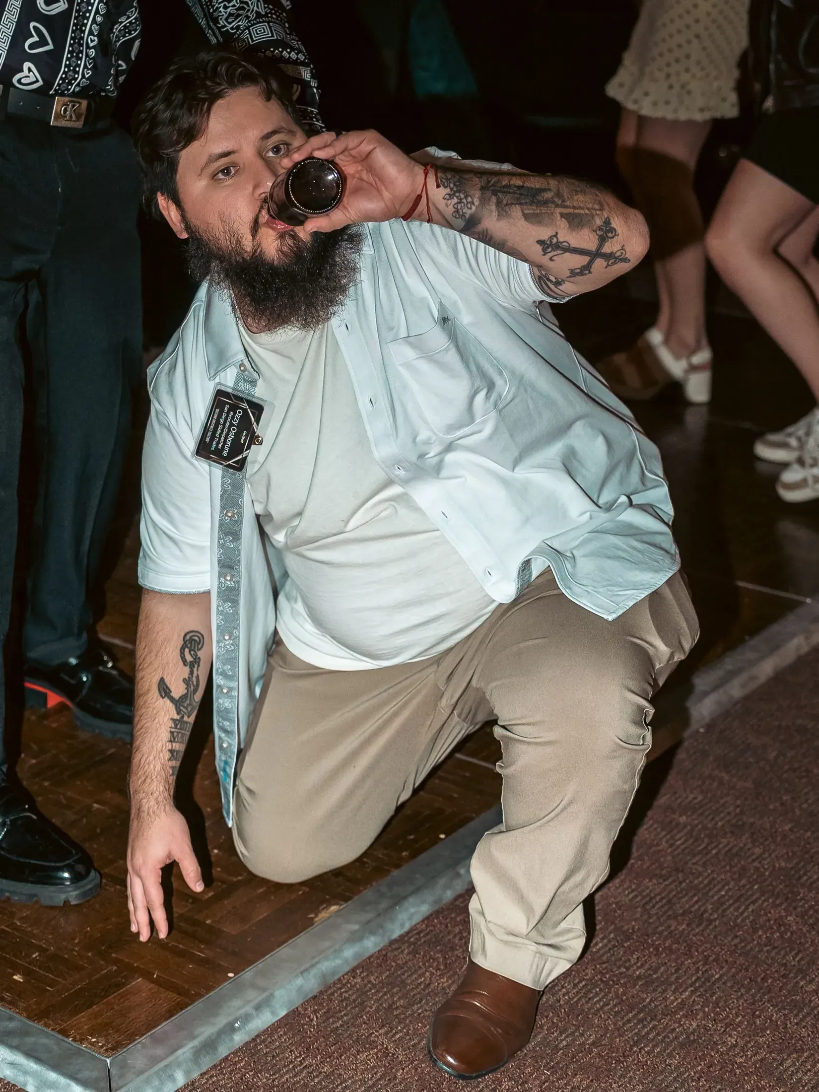 Guest crouching on the dance floor