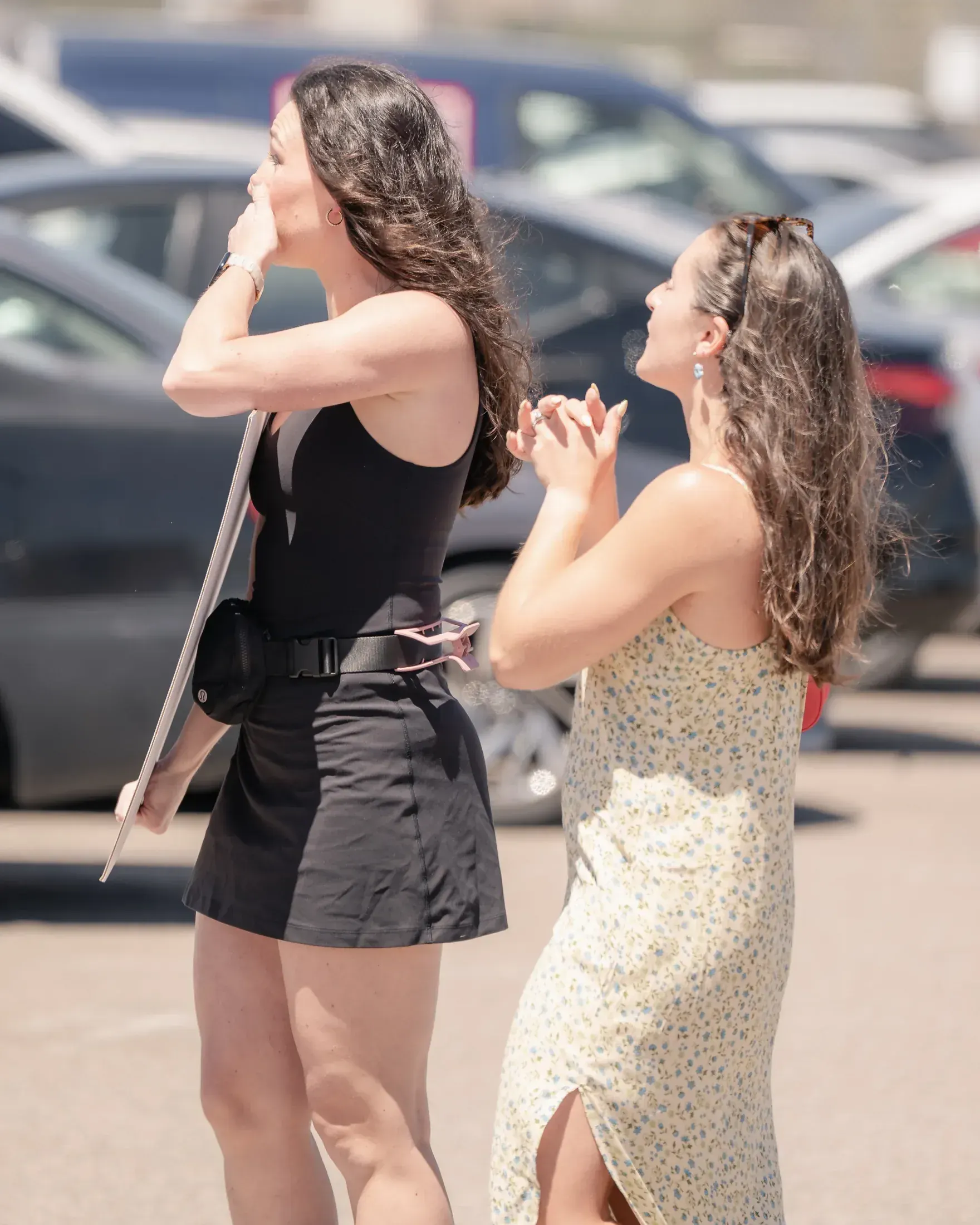 Two women waiting nervously for a Marine homecoming