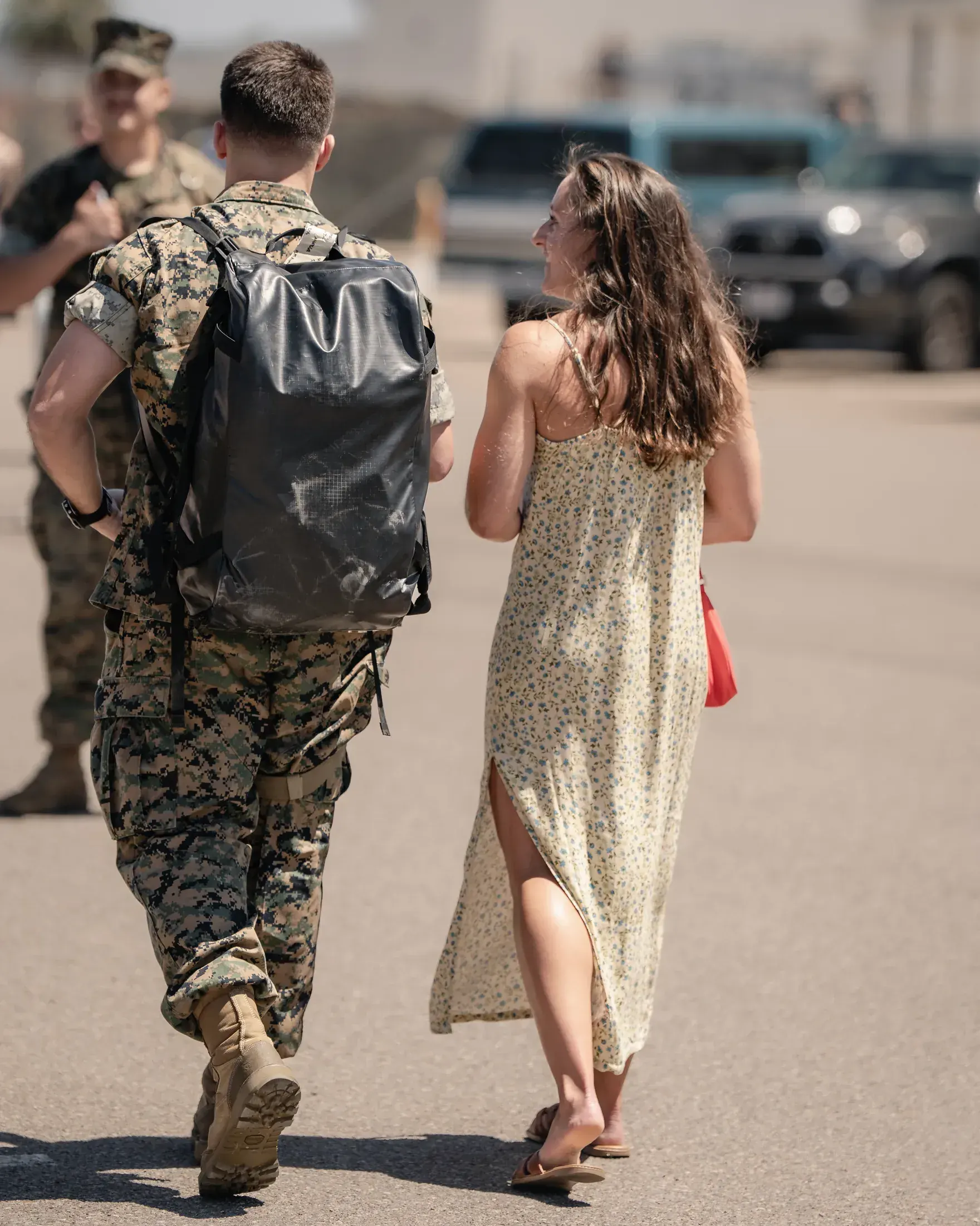 Marine and his partner walking away from the homecoming together