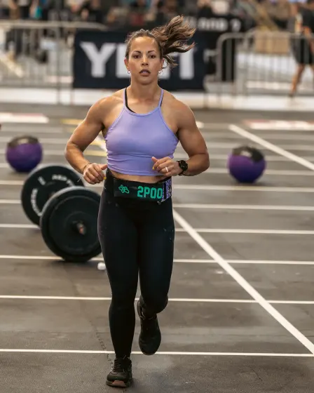 Athlete running toward the camera on the competition floor