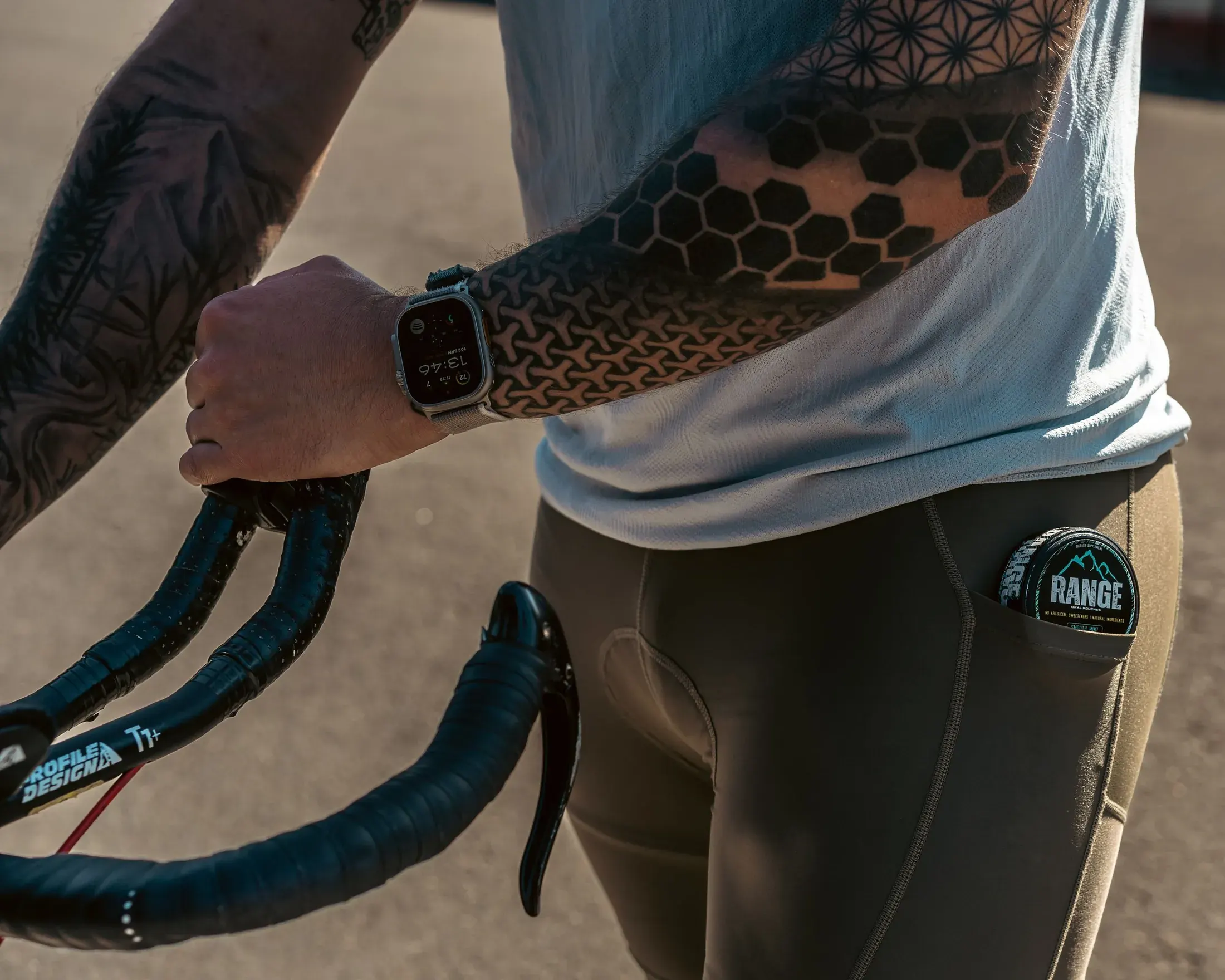 Cyclist with a Range tin in his jersey pocket
