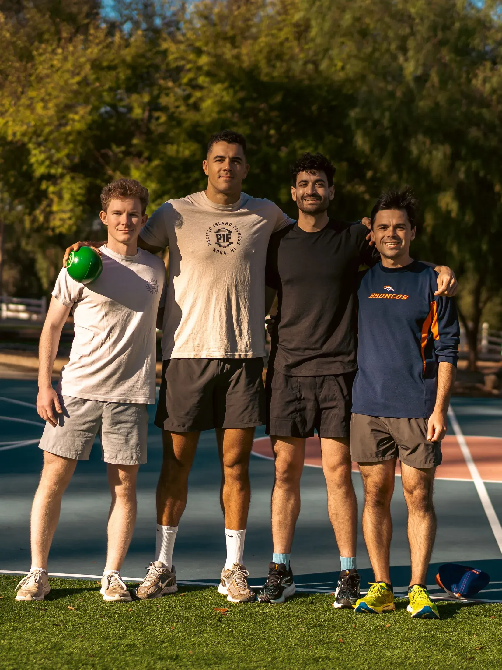 Group of friends on a court at an outdoor event